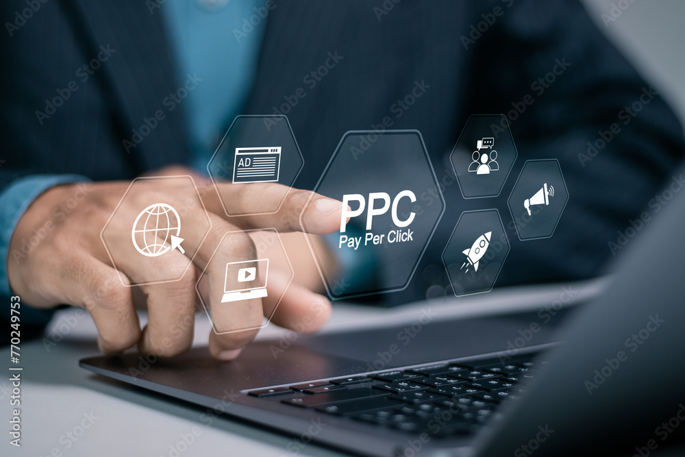 Pay per click PPC concept. Advertising in Search Engine Platforms. Digital Marketing Strategies and Goals. Businessman using laptop with PPC icon on virtual screen.